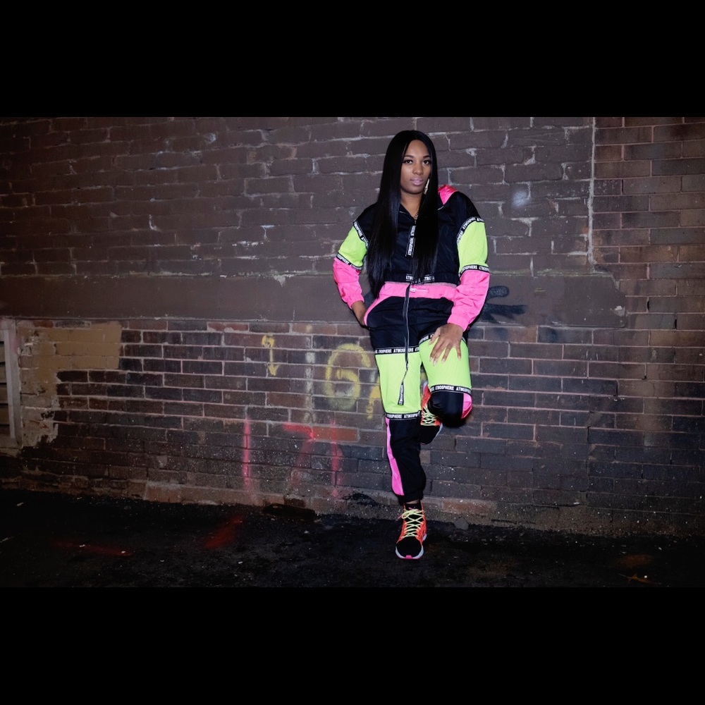 Multi color sweatsuit trimmed in pink and neon